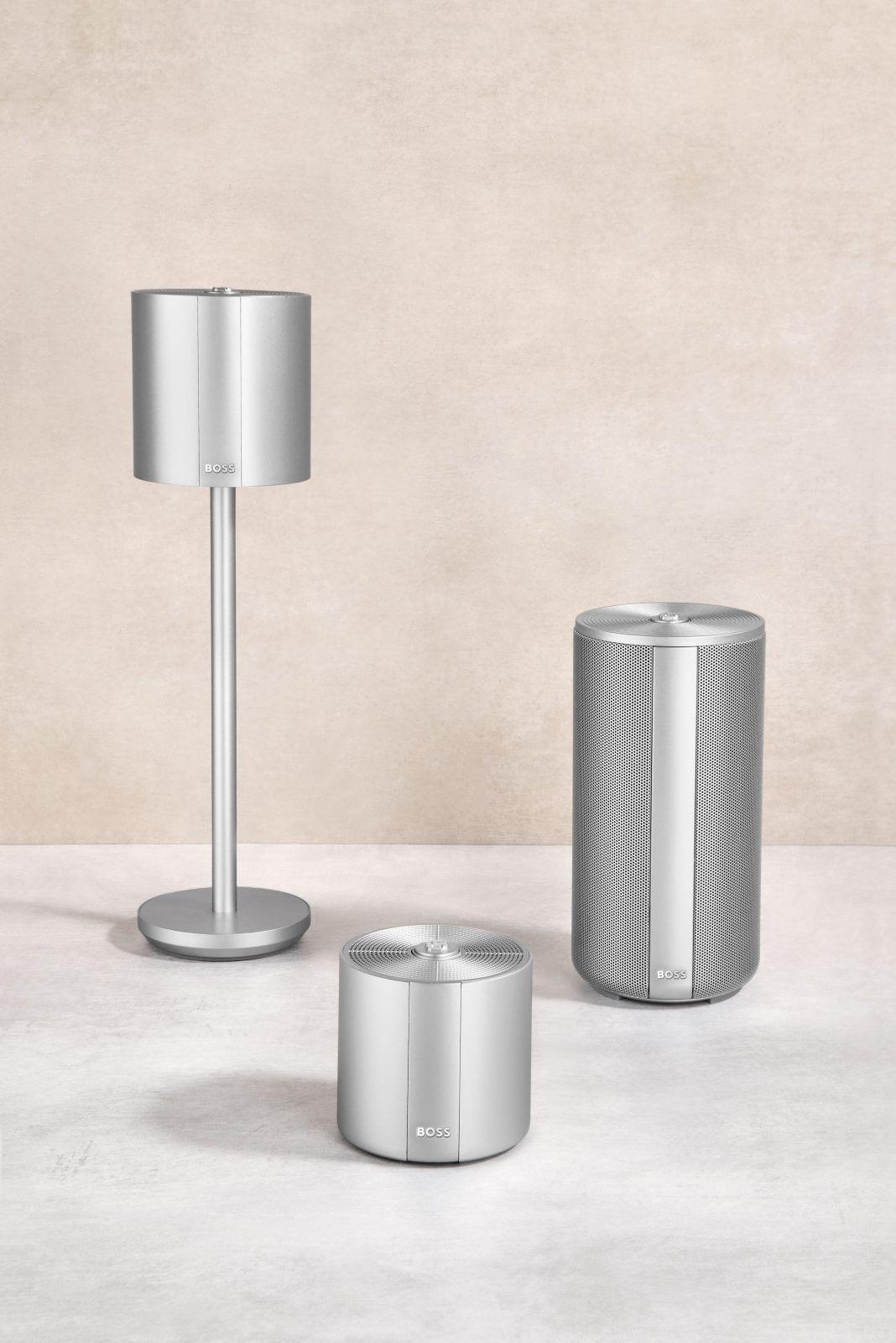 Cordless table lamp and a portable speaker in brushed metal — Hugo Boss